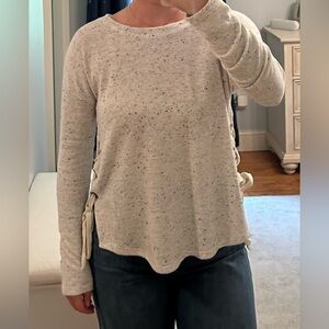 Grey vintage Havana sweater with cream ties on both sides. Medium